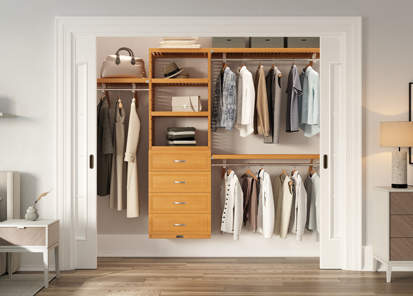 honey maple closet system with drawers organizing clothes in a reach in closet