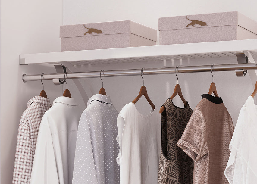 white shelf with garment bar with hanging clothes in closet